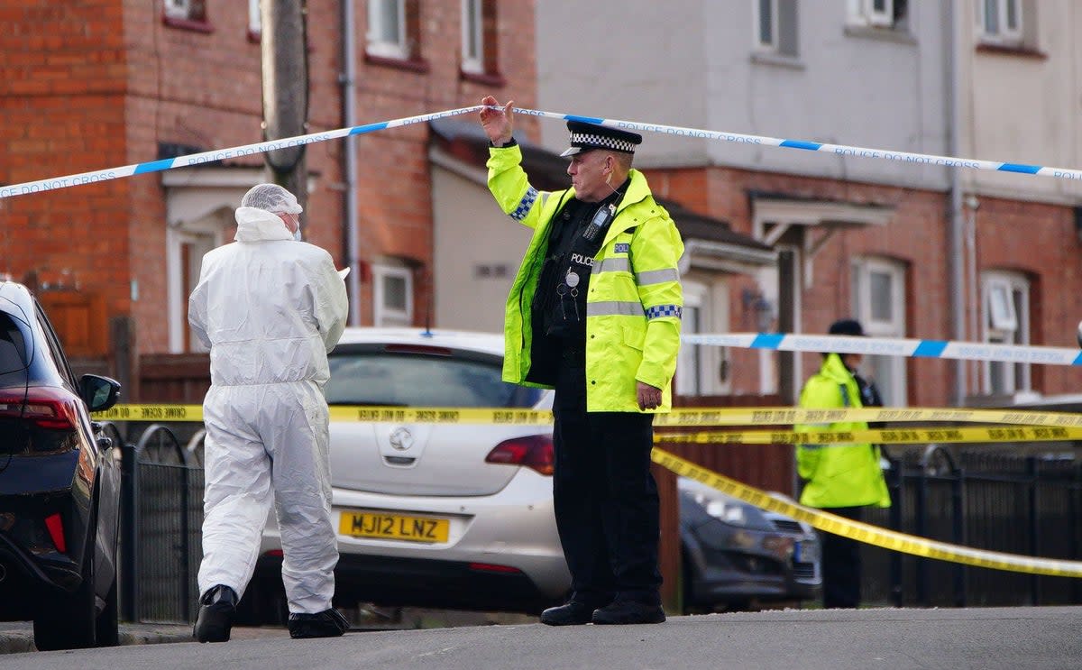 Police and forensic investigators at scene in south Bristol on Sunday (PA)