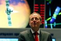 Jan Woerner, Director General of the European Space Agency (ESA) looks up prior to an exclusive Reuters interview in the main control room of the European Space Operations Centre (ESOC) in Darmstadt, Germany June 17, 2016. REUTERS/Ralph Orlowski