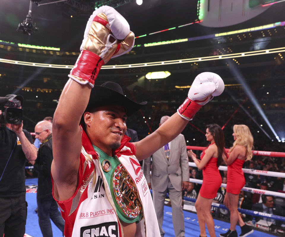 Mikey Garcia gestures for the crowd before an IBF World Welterweight Championship boxing bout against Errol Spence Jr. Saturday, March 16, 2019, in Arlington, Texas. (AP Photo/Richard W. Rodriguez)