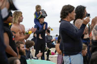 Surfers participate in a paddle out ceremony at "The Ink Well," a beach historically known as a surfing refuge for African Americans, to honor the life of George Floyd on Friday, June 5, 2020, in Santa Monica, Calif. Floyd died after he was restrained in police custody on Memorial Day in Minneapolis. (AP Photo/Ashley Landis)