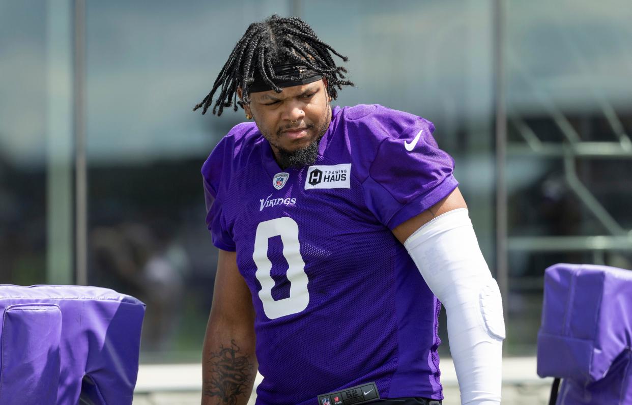 Minnesota Vikings linebacker Marcus Davenport prepares for drills before an NFL football practice Saturday, July 29, 2023, in Eagan, Minn.