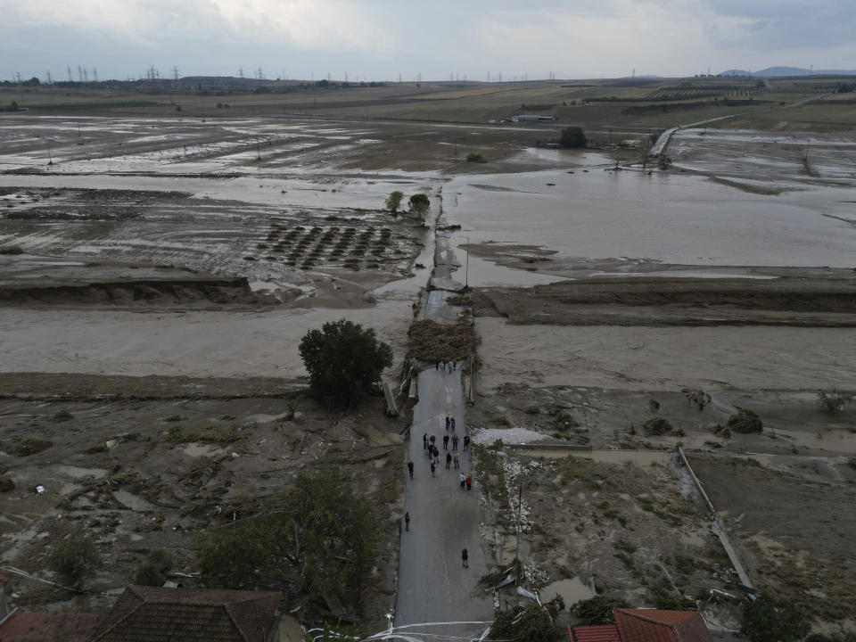 FILE - Floodwaters and mud cover the land after the country's record rainstorm, in the village of Nea Lefki, in Thessaly region, central Greece, on Sept. 6, 2023. The storms flooded 720 square kilometers (72,000 hectares), mostly prime farmland, totally destroying crops. They also swamped hundreds of buildings, broke the country's railway backbone, savaged local roads and bridges and killed tens of thousands of livestock. Thessaly accounts for about 5% of national economic output, and a much larger proportion of agricultural produce. (AP Photo/Vaggelis Kousioras, File)