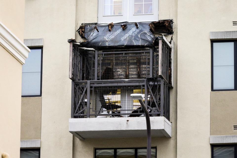Damage is seen at the scene of a 4th-story apartment building balcony collapse in Berkeley, California