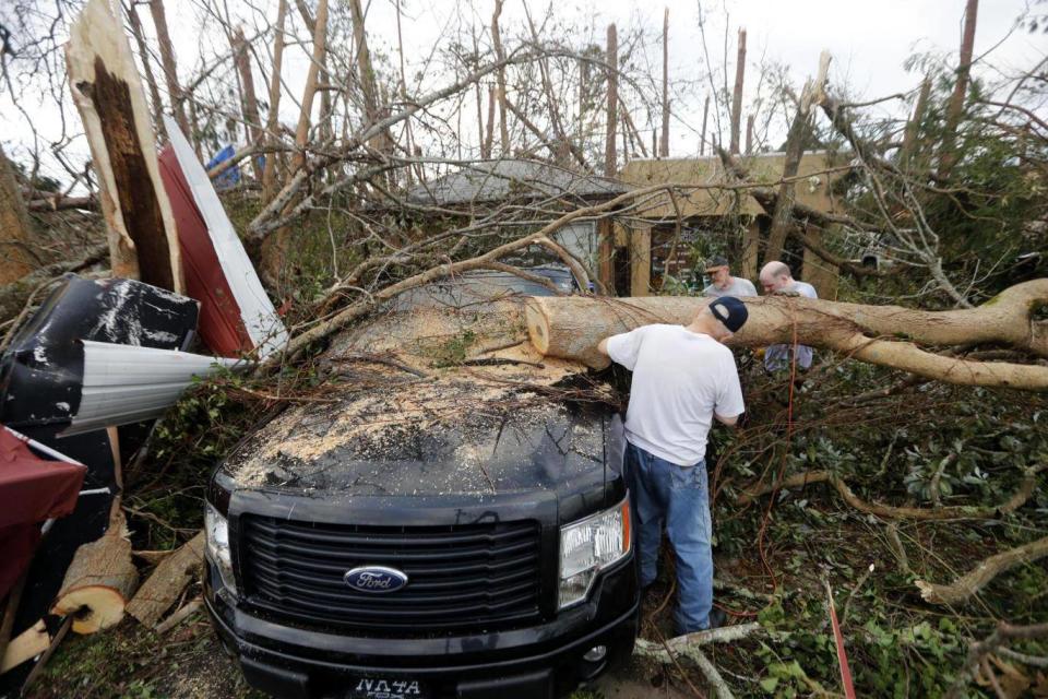 People begin to clear up after of Hurricane Michael in Panama City, Florida (AP)