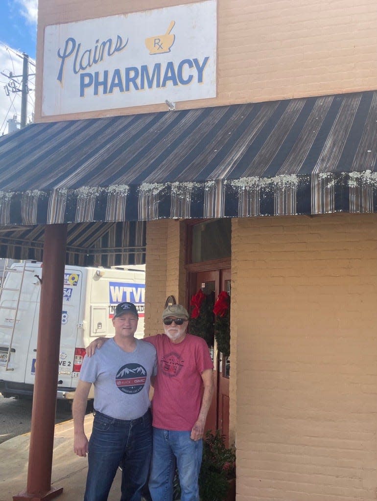 Stan and Jack Keeley stand outside the Plains Pharmacy on a visit to Plains, Georgia on Monday, Nov. 23, 2023.