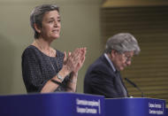 European Commissioner for Europe fit for the Digital Age Margrethe Vestager, left, and European Commissioner in charge of internal market Thierry Breton participate in a media conference on an EU approach to artificial intelligence, following a weekly meeting of EU Commissioners, at EU headquarters in Brussels, Wednesday, April 21, 2021. (Olivier Hoslet, Pool via AP)