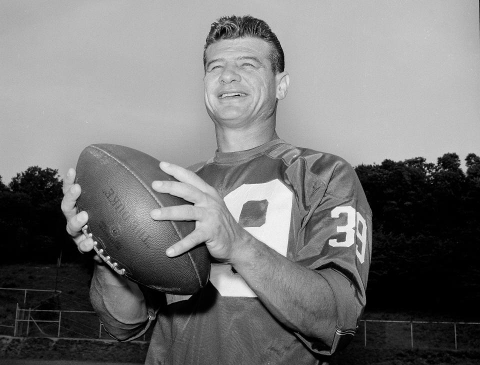 FILE - York Giants Halfback Hugh McElhenny, poses at the team's NFL football training camp in Fairfield, Conn., on Sept. 3, 1963. McElhenny, an elusive NFL running back nicknamed “The King,” died on June 17, 2022, at his home in Nevada, his son-in-law Chris Permann confirmed Thursday, June 23, 2022. He was 93. (AP Photo/Harry Harris, File)