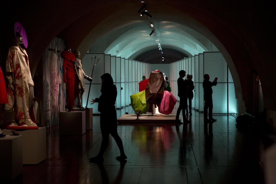 Items by different designers are displayed at the press view of the "Isabella Blow: Fashion Galore!" exhibition in London, Tuesday, Nov. 19, 2013. The exhibition, which runs from November 20 to March 2, celebrates the life and wardrobe of the late British patron of fashion and art who discovered many young fashion design talents. (AP Photo/Matt Dunham)