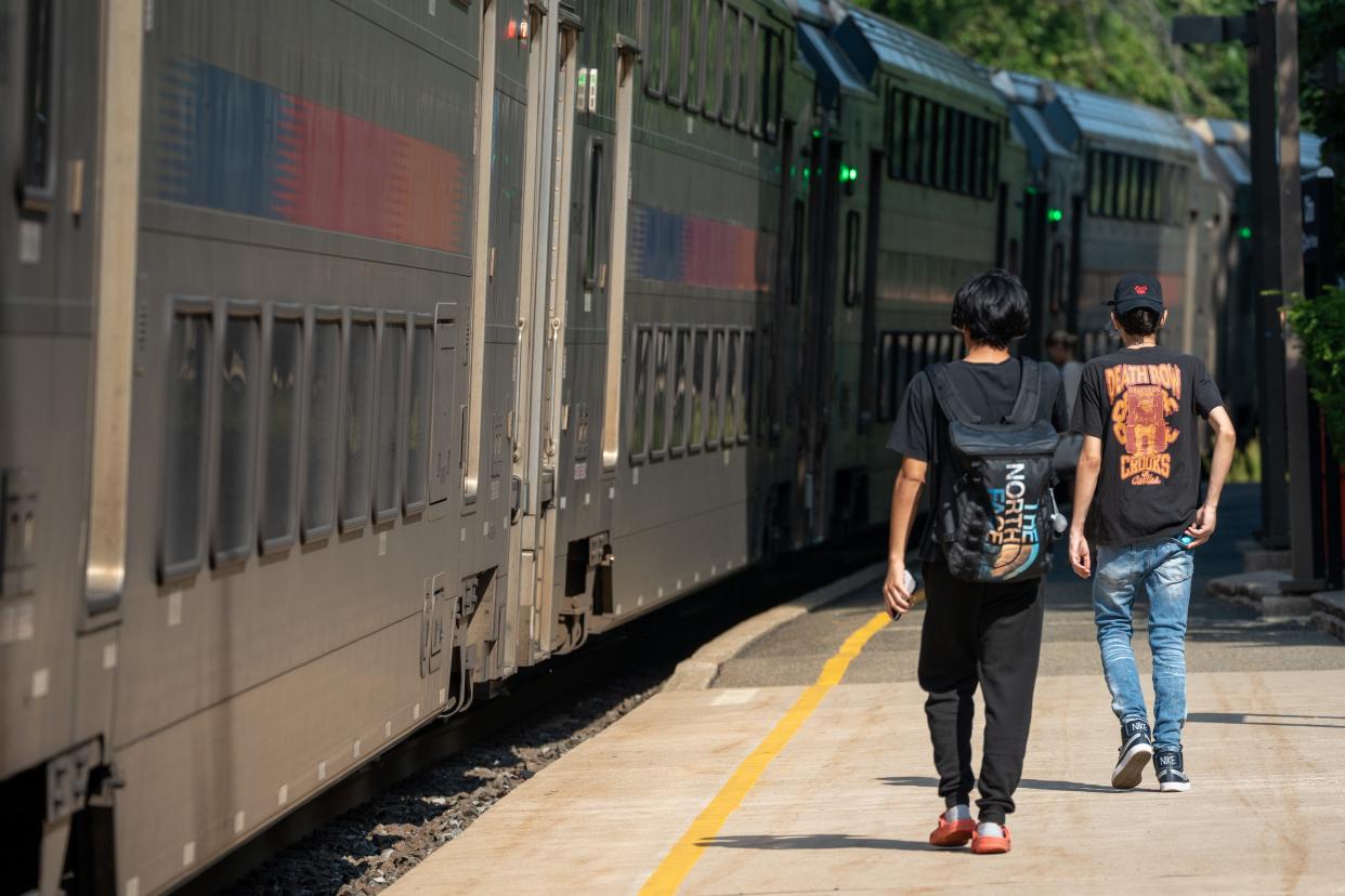 Commuters catch an NJ Transit train during the first day of a fare holiday at NJ Transit station in Clifton on Monday, Aug. 26, 2024. The fare holiday provides free transportation on NJ Transit from Aug. 26 through Sept. 2.