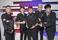 File - This Oct. 17, 2019, file photo shows Erick Brian Colon, from left, Christopher Velez, Richard Camacho, Zabdiel de Jesus and Joel Pimentel, of CNCO, posing backstage with the awards for favorite pop artists and favorite duo or group at the Latin American Music Awards in Los Angeles. The Latin American boy band CNCO is downsizing. The group announced on its official Instagram page Sunday, May 9, 2021, that 22-year-old Pimentel is leaving the band, making the successful quintet a quartet. (Photo by Richard Shotwell/Invision/AP, File)