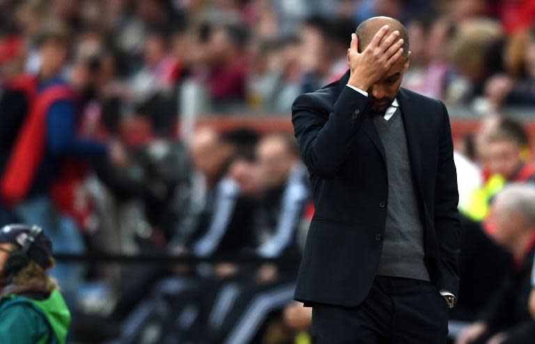 Bayern Munich's head coach Pep Guardiola reacts during the German first division Bundesliga football match against Bayer 04 Leverkusen on May 2, 2015