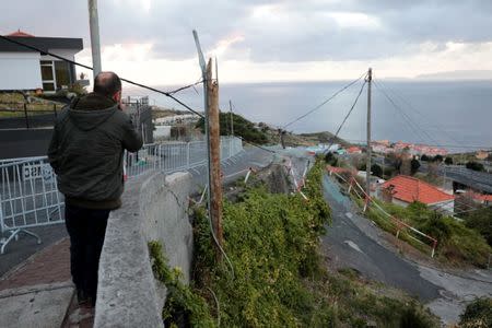 A resident looks at the site of a bus accident, in Canico, in the Portuguese Island of Madeira, April 18, 2019. REUTERS/Duarte Sa