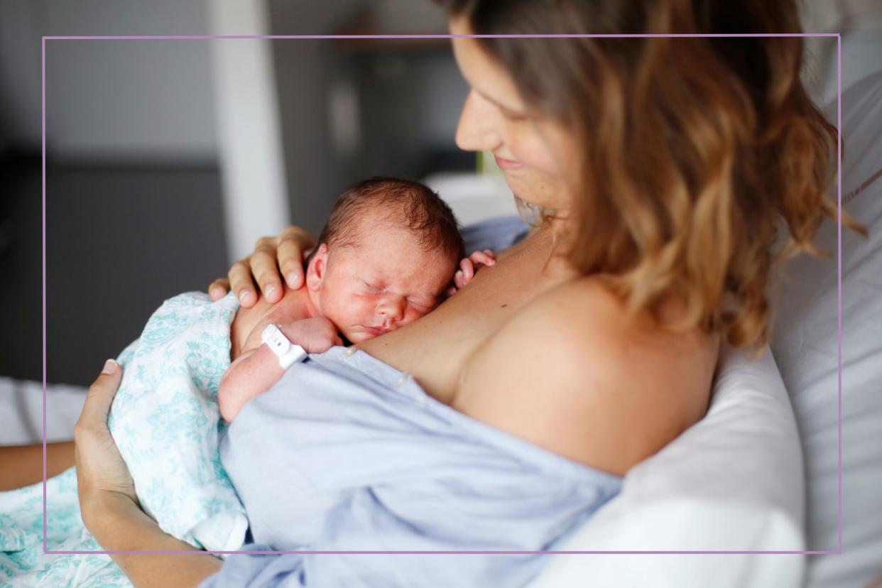  Woman in hospital bed doing skin on skin with newborn  baby. 