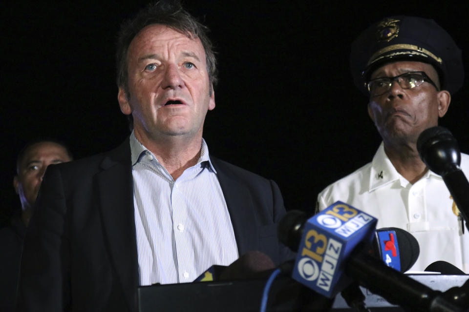 FILE - Annapolis Mayor Gavin Buckley speaks at a news conference about a shooting that left several people dead and wounded, late Sunday, June 11, 2023, in Annapolis, Md. Annapolis Police Chief Ed Jackson stands at right. A man has been charged with hate crimes in the shooting deaths of three people last month in Maryland's capital city the state capital after a dispute over parking that also resulted in three people being wounded. (AP Photo/Brian Witte, File)