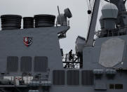 <p>Personnel work on the U.S. Navy guided-missile destroyer USS John S. McCain after a collision, in Singapore waters Aug. 21, 2017. (Photo: Ahmad Masood/Reuters) </p>