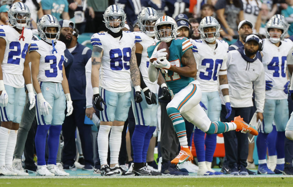 Miami Dolphins wide receiver Jaylen Waddle on a pass reception during the first half of an NFL football game against the Dallas Cowboys on Sunday, Dec. 24, 2023, in Miami Gardens, Fla. (Al Diaz/Miami Herald via AP)