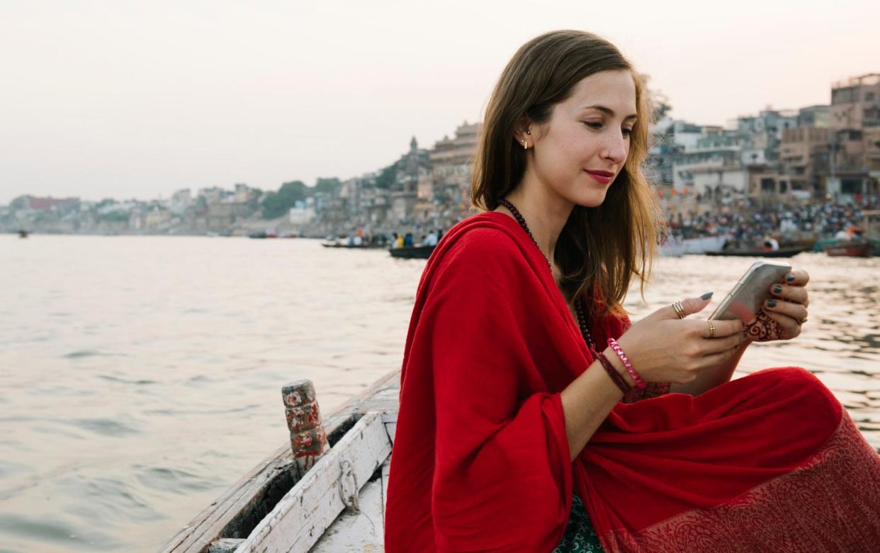 Woman tourist texting in India