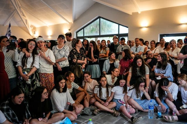 Mourners at the funeral of the two British-Israeli sisters