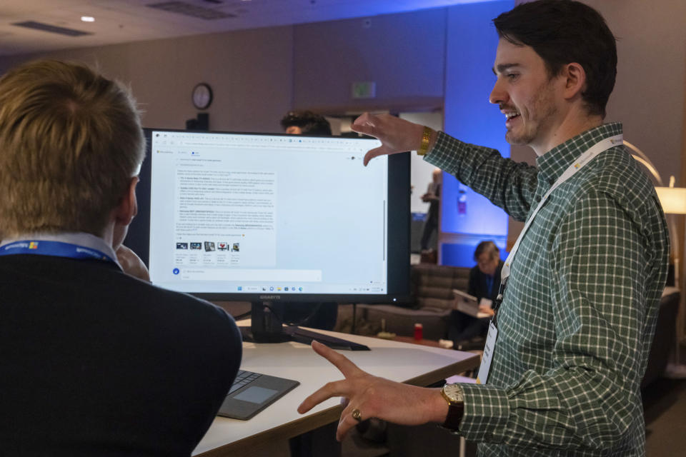 Microsoft employee Alexander Campbell demonstrates the integration of Microsoft Bing search engine and Edge browser with OpenAI on Tuesday, Feb. 7, 2023, in Redmond, Wash. (AP Photo/Stephen Brashear)