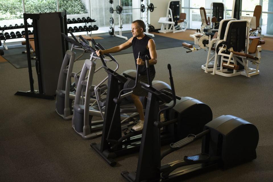 man using elliptical trainer