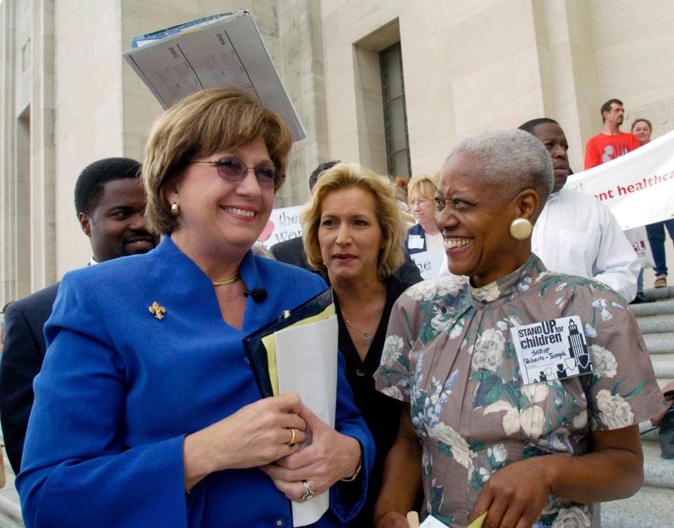 Then-Gov. Kathleen Blanco, left, talks with Sadie Roberts-Joseph, right, before the start of the Stand Up for Children 2004 Rally for Children on the steps of the state Capitol in Baton Rouge, La.