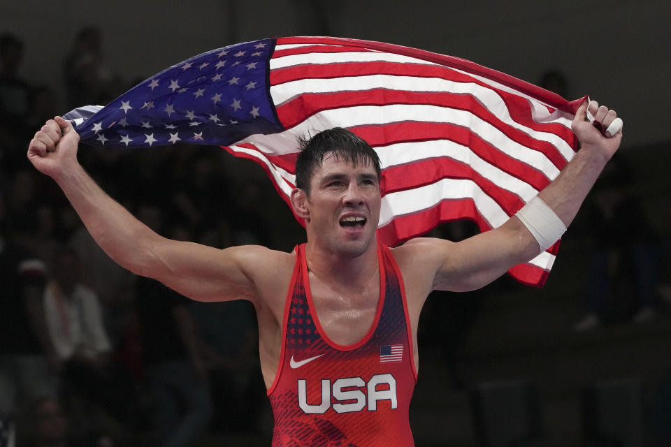 ldar Hafizov of the United States celebrates his gold medal victory over Cuba's Kevin de Armas at the end of their men's greco roman 60kg match, at the Pan American Games in Santiago, Chile, Friday, Nov. 3, 2023.(AP Photo/Dolores Ochoa)