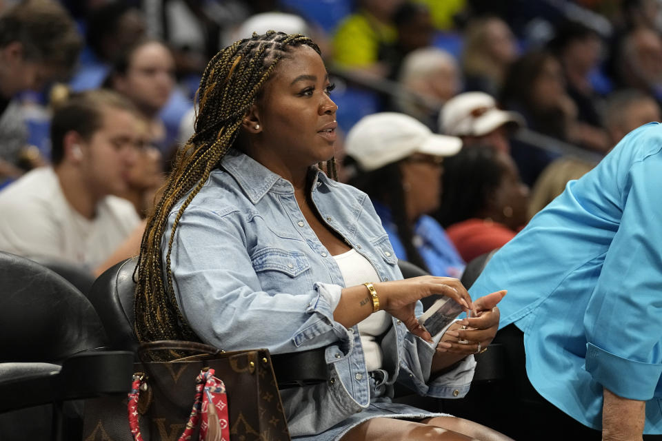 Cherelle Griner, wife of Brittney Griner, watches during the first half of a WNBA basketball game between the Phoenix Mercury and the Dallas Wings, Wednesday, June 7, 2023, in Arlington, Texas. (AP Photo/Tony Gutierrez)