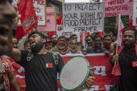 Members of Communist Party of India shout slogans during a protest against farm laws in Mumbai, India Monday, Sept. 27, 2021. The farmers called for a nation-wide strike Monday to mark one year since the legislation was passed, marking a return to protests that began over a year ago. (AP Photo/Rafiq Maqbool)