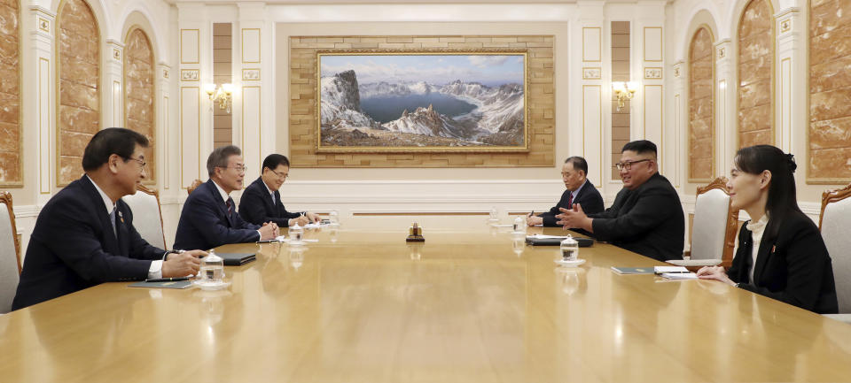 North Korean leader Kim Jong Un, right center, talks with South Korean President Moon Jae-in, left center, as North Korean leader Kim Jong Un's sister Kim Yo Jong, right, sits during their summit at the headquarters of the Central Committee of the Workers' Party in Pyongyang, North Korea, Tuesday, Sept. 18, 2018. (Pyongyang Press Corps Pool via AP)