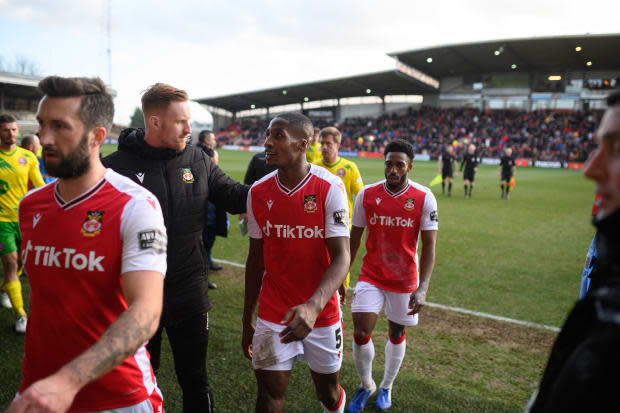 Wrexham Association Football Club's players leave the pitch at half-time during National League fixture football match against Maidenhead United, at the Racecourse Ground stadium in Wrexham, north Wales, on Jan. 29, 2022. Ryan Reynolds and Rob McElhenney completed their purchase of Wrexham AFC in February 2021.<p><a href="https://www.gettyimages.com/detail/1238389544" rel="nofollow noopener" target="_blank" data-ylk="slk:OLI SCARFF/Getty Images;elm:context_link;itc:0;sec:content-canvas" class="link ">OLI SCARFF/Getty Images</a></p>