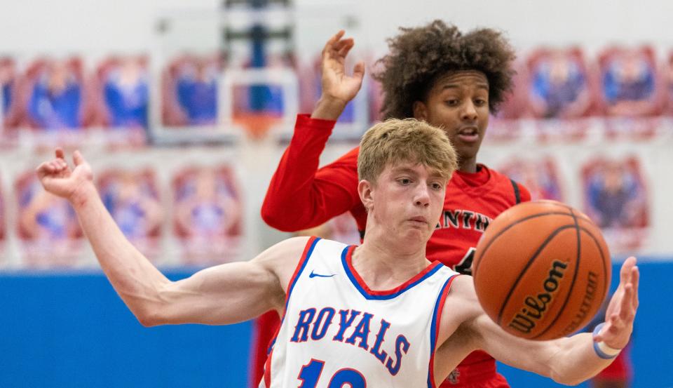 Drew Kegerreis controls a ball as he works against Christian Woodson of North Central High School during game action at Roncalli High School, Tuesday, Jan 11, 2023, won by RHS 56-54. 