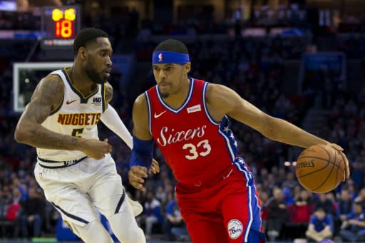 Philadelphia's Tobias Harris drives to the basket against Denver's Will Barton in the 76ers' 117-110 NBA victory over the Nuggets