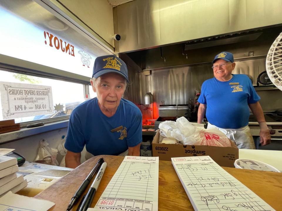 After 43 years in business, owners David and Laura Mount have closed the iconic Burger Depot restaurant on Highway 18 in Lucerne Valley. The couple is shown here taking one of their last orders.