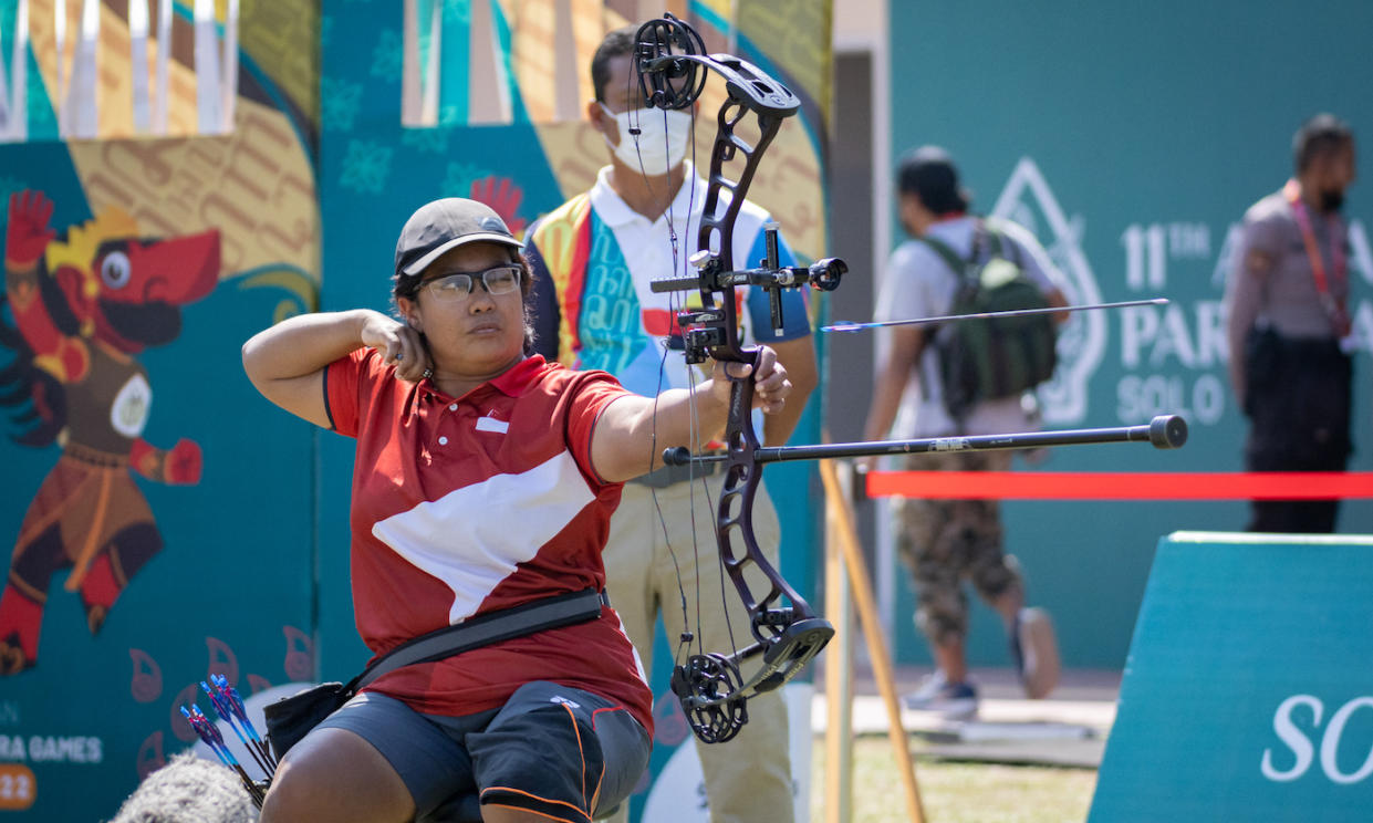 Singapore para-archer Nur Syahidah Alim in action at the 2022 Asean Para Games in Solo, Indonesia. (PHOTO: SNPC/Goh Si Wei)