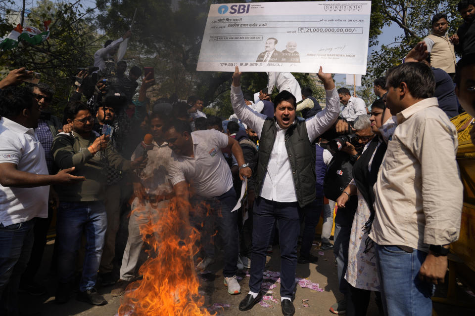 Members of opposition Congress party, demanding an investigation into allegations of fraud and stock manipulation by India's Adani Group shout slogans during a protest in New Delhi, India, Monday, Feb.6, 2023. The Congress party urged people to protest, adding to pressure on Prime Minister Narendra Modi to respond to a massive sell-off of shares in Adani Group companies after a U.S.-based short-selling firm, Hindenburg Research, accused them of various fraudulent practices. The Adani group has denied any wrongdoing. (AP Photo/Manish Swarup)