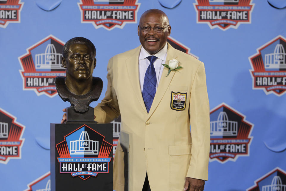 FILE - In this Aug. 7, 2010 file photo, Floyd Little poses with his bust after enshrinement in the Pro Football Hall of Fame in Canton, Ohio. Little, the Hall of Fame running back who starred at Syracuse and for the Denver Broncos, has died. The Pro Football Hall of Fame said he died Friday, Jan. 1, 2021. (AP Photo/Mark Duncan, File)
