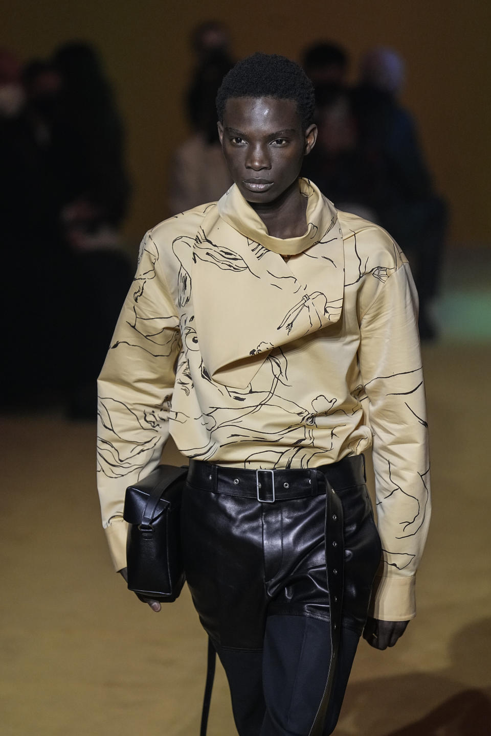 A model wears a creation for the Jil Sander fall-winter 22/23 men's collection, in Paris, Friday, Jan. 21, 2022. (AP Photo/Michel Euler)