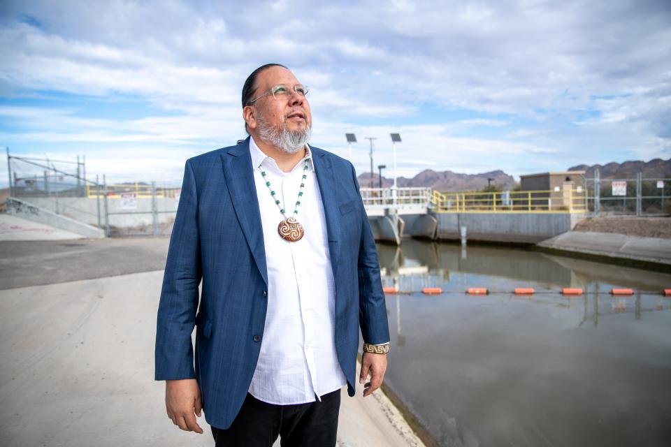 Gila River Indian Community Gov. Stephen Roe Lewis stands by a canal in Sacaton, Arizona, on Dec. 8, 2021.