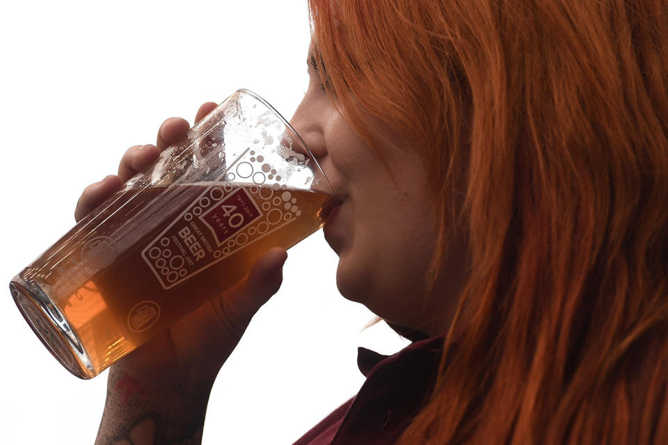 <p>A woman enjoys a pint of ale at the CAMRA (Campaign for Real Ale) Great British Beer festival at Olympia exhibition center on August 8, 2017 in London, England. (Photo: Carl Court/Getty Images) </p>