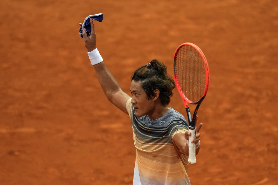 Zhang Zhizhen of China celebrates his victory over Taylor Fritz, of the United States, at the Madrid Open tennis tournament in Madrid, Spain, Tuesday, May 2, 2023. (AP Photo/Manu Fernandez)