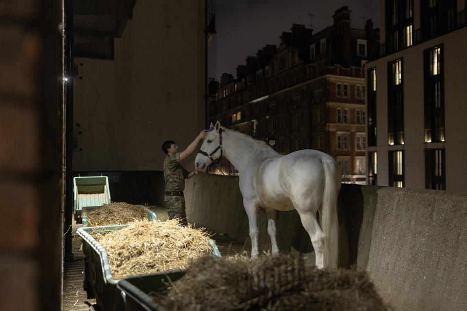 Members of the Household Cavalry Mounted Regiment prepare for a night time rehearsal for the coronation of King Charles III at Hyde Park Barracks on April 17.<span class="copyright">Dan Kitwood—Getty Images</span>