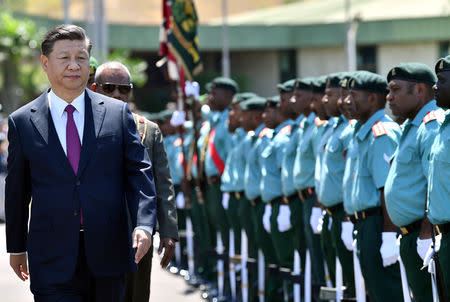 China's President Xi Jinping inspects the guard of honour at Parliament House in Port Moresby on November 16, 2018, ahead of Asia-Pacific Economic Cooperation (APEC) Summit. Saeed Khan/Pool via REUTERS