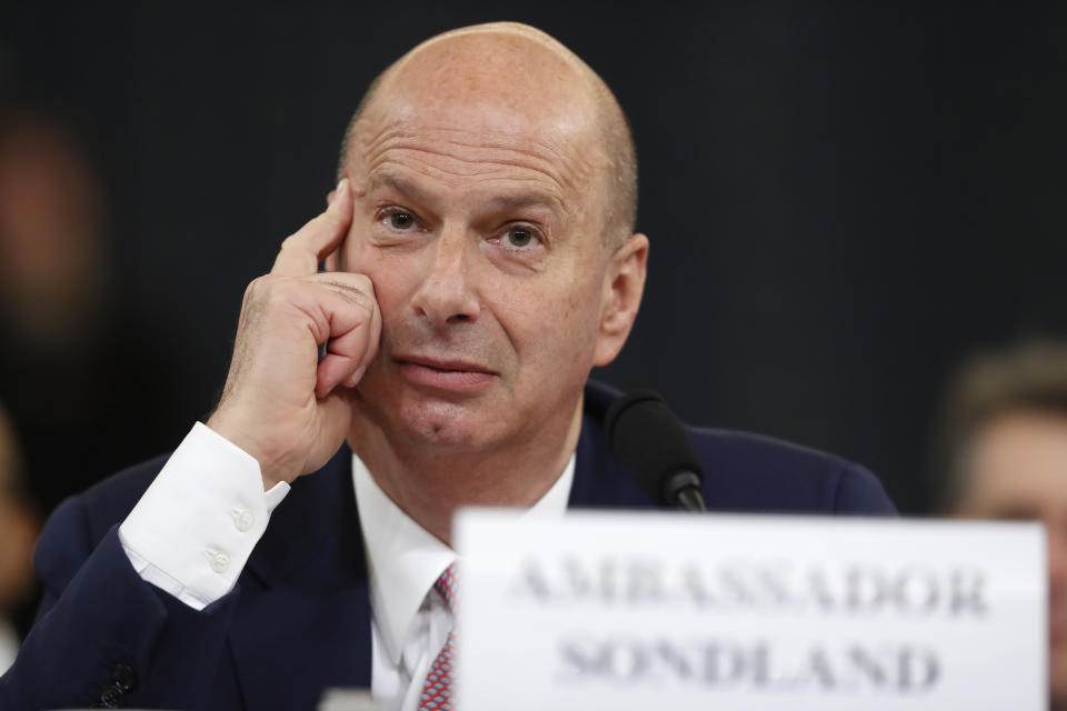 U.S. Ambassador to the European Union Gordon Sondland listens as he testifies before the House Intelligence Committee on Capitol Hill in Washington, Wednesday, Nov. 20, 2019, during a public impeachment hearing of President Donald Trump's efforts to tie U.S. aid for Ukraine to investigations of his political opponents. (AP Photo/Andrew Harnik)