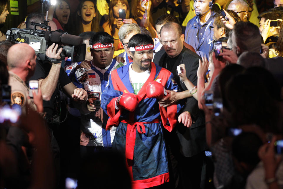 Manny Pacquiao, from the Philippines, arrives for his WBO welterweight title fight against Timothy Bradley, from Palm Springs, Calif., Saturday, June 9, 2012, in Las Vegas. (AP Photo/Julie Jacobson)