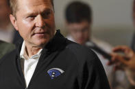 In this Friday, Dec. 10, 2019 photo, sports agent Scott Boras, wearing a jacket with his personal logo, speaks at the Major League Baseball winter meetings in San Diego. Nearly 30 years after negotiating his first contract, Boras worked out $814 million in deals for Stephen Strasburg, Gerrit Cole and Anthony Rendon in a three-day span, part of what is expected to be a $1.2 billion offseason for baseball's most visible agent. (AP Photo/Gregory Bull)