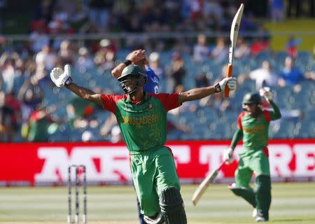 Bangladesh batsman Mohammad Mahmudullah reacts after scoring his nation's first ever century in a world cup during their Cricket World Cup match against England in Adelaide, March 9, 2015. REUTERS/David Gray