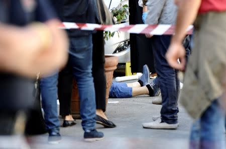 Mafia boss Giuseppe Dainotti's body lies on ground after he was shot to death in Palermo, Italy May 22, 2017. Picture taken May 22, 2017. REUTERS/Guglielmo Mangiapane