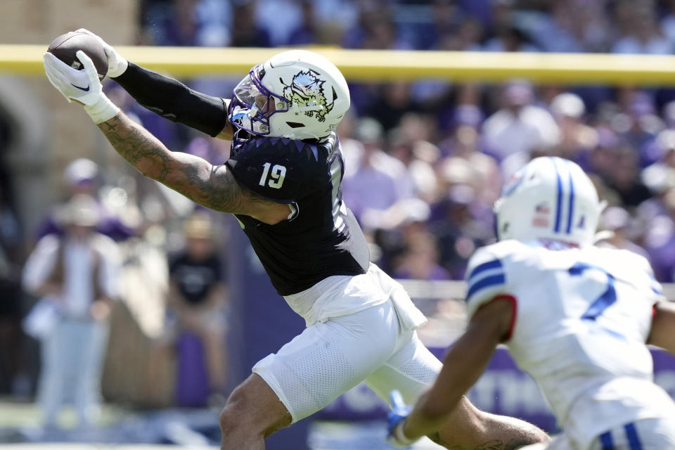 TCU tight end Jared Wiley (19) catches a pass in front of SMU safety Jonathan McGill (2) during the second half of an NCAA college football game Saturday, Sept. 23, 2023, in Fort Worth, Texas. (AP Photo/LM Otero)