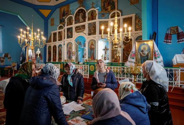 Members of the church choir, which switched from the Ukrainian Orthodox Church to the Orthodox Church rehearsing, amid Russia's attack on Ukraine, in the village of Hrabivtsi