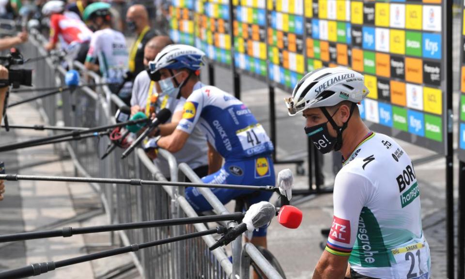 Peter Sagan of Team Bora - Hansgrohe and fellow riders are socially distanced as they speak to the media ahead of the first stage.